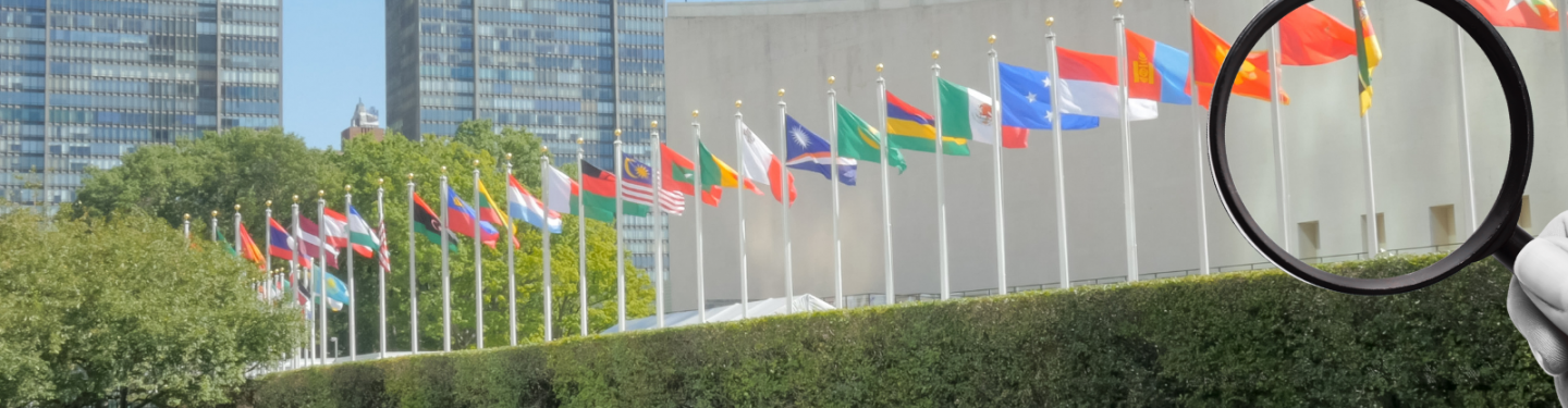 Magnifying glass in front of UN HQ