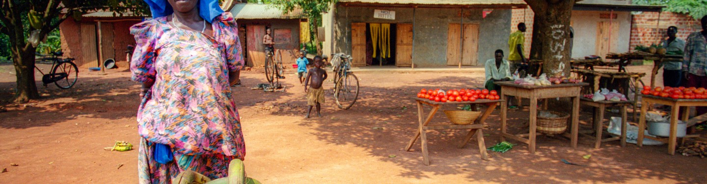 Woman selling bananas on a market in Uganda