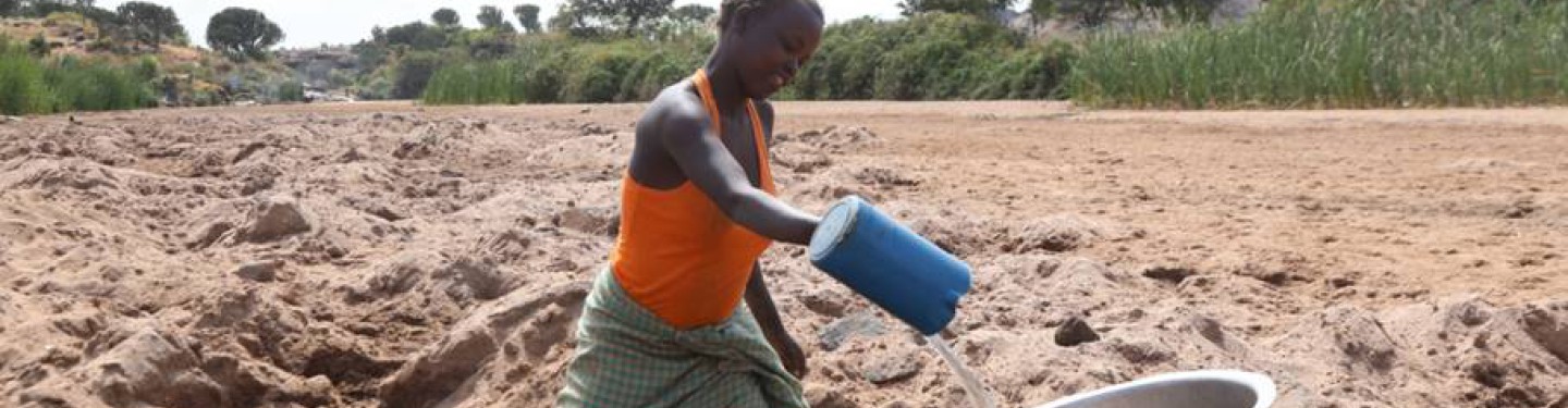 Woman on the fields in Karamoja