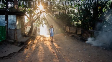 Woman walking on a street in the Philippines