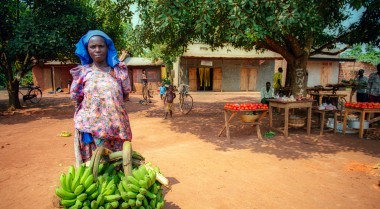 Woman selling bananas on a market in Uganda 