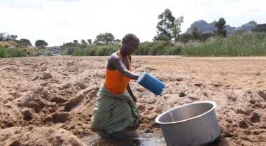 Woman on the fields in Karamoja