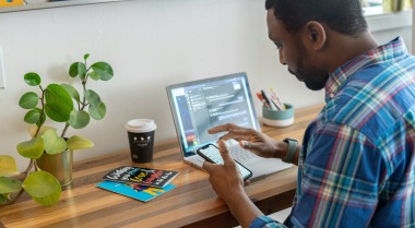 A man sitting in front of a computer